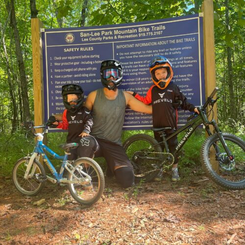 Dad and sons riding bikes at San Lee Gravity Park for Kids Ride MTB
